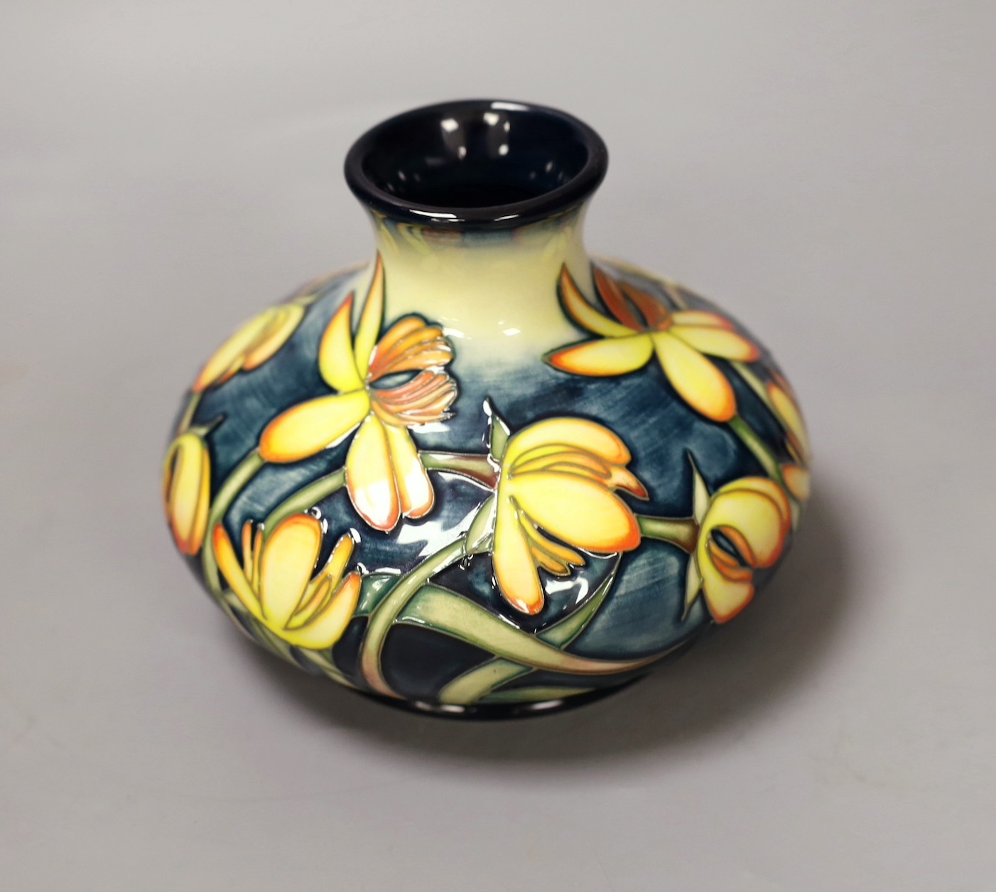 A Moorcroft pottery squat shaped vase, decorated with the 